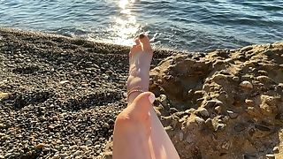 Mistress Lara Plays With Her Feet And Toes On The Beach